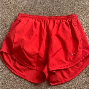 L Red Nike shorts